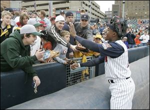 Curtis Granderson greets fans at Fifth Third Field during a 2008 rehab stint. 