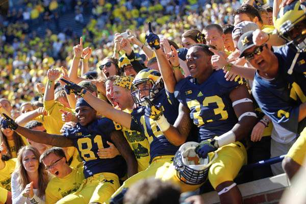 Michigan-players-and-student-celebrate-beating