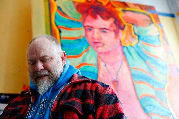 Local-artist-and-resident-Greg-Tarrant-stands-in-his-studio