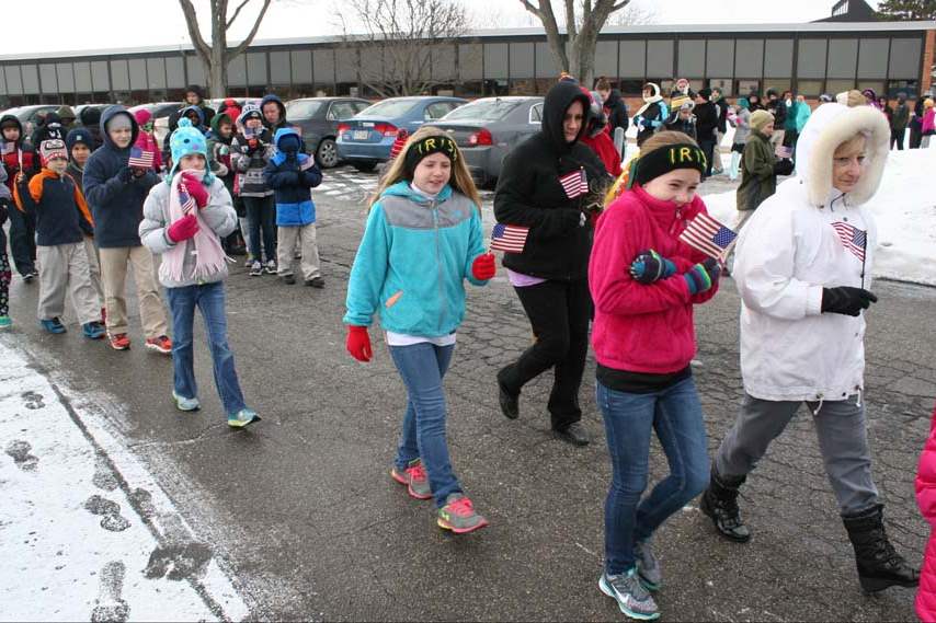 collinsfuneral-st-pat-students-flags