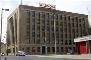 U-Haul's parent company has completed its purchase of the Willis Day building.