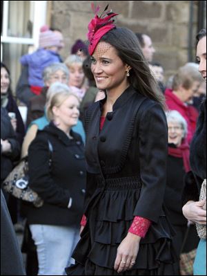 Britain's Pippa Middleton arrives at the wedding of the Duke and Duchess of Northumberland's eldest daughter Lady Katie Percy to city financier Patrick Valentine at St Michael's Church in Alnwick, England. Feb. 2016.
