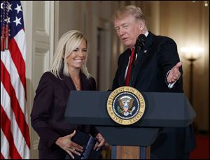 President Donald Trump announces the nomination of Kirstjen Nielsen to be Secretary of Homeland Security, in the East Room of the White House, Thursday, Oct. 12.