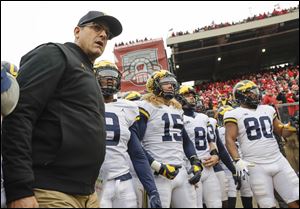 Michigan head coach Jim Harbaugh and his team could alleviate a disappointing season with a big win over Ohio State.
