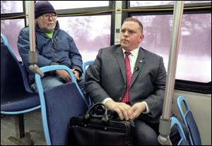 Richard Arnold, left, and Mayor Wade Kapszukiewicz on a TARTA bus January 8, 2018. During his campaign, Kapszukiewicz said he will not use a city car and will take a TARTA bus to work once a week.