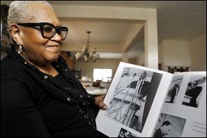 Sadicka White, looks at her Ohio Northern University yearbook at her Columbus home, Wednesday, January 10, 2018. Known as Dianne Harrison at the time, she was a sophomore at Ohio Northern University when Dr. Martin Luther King, Jr., came and spoke on campus Jan. 11, 1968.