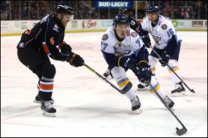 Connor Crisp, right, was one of six players to whom the Walleye gave a qualifying offer.