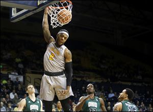 Toledo's Taylor Adway (2) dunks the ball during Tuesday's basketball game between Toledo and Ohio.