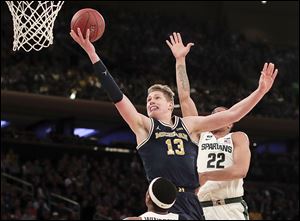 Michigan forward Moritz Wagner gives the Wolverines a height advantage inside at 6-foot-11.