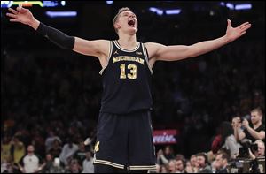 Michigan forward Moritz Wagner reacts as time winds off the clock at the end of the Wolverines' win over Michigan State in the Big Ten Tournament semifinals.
