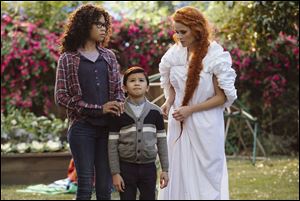 From left, Storm Reid, Deric McCabe, and Reese Witherspoon appear in a scene from 'A Wrinkle In Time.'