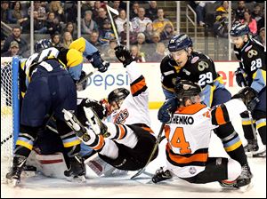 Toledo Walleye goalie Pat Nagle defends the net against the Fort Wayne Komets. The ECHL has implemented video replay at four venues this season, including Toledo's Huntington Center.