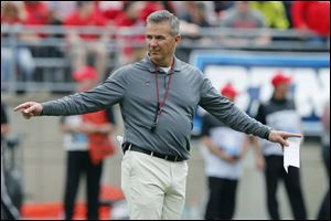 Ohio State head coach Urban Meyer watches his team's spring football game Saturday, April 14, 2018.