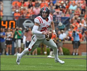 Michigan quarterback Shea Patterson was selected by the Texas Rangers in the 39th round of the MLB draft.