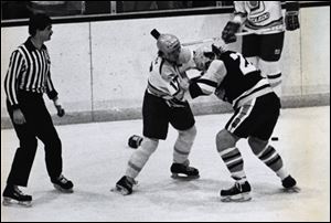 Toledo Goaldiggers hockey player Chris McSorley (17) fights Muskegon's Richard Zemlak (22) in photo dated Jan 4, 1985. McSorley is the latest inductee to the Toledo Hockey Hall of Fame. 