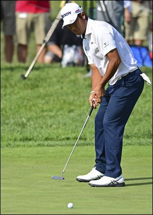 Hideki Matsuyama follows his putt on the 18th hole during the first round of the Memorial golf tournament Thursday, May 31, 2018, in Dublin, Ohio. 