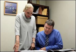 Lucas County Prosecutor Julia Bates speaks with Det. Jay Gast.