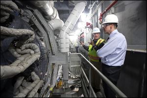 Peter Rigney, left, projects general manager, shows Rich Cordray, right, Democratic candidate for governor, the gas turbine in the Oregon Clean Energy Center during a tour on July 9, 2018.