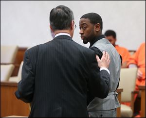 Wesley McClellan Kincaid confers with attorney Jerome Phillips during his arraignment in Lucas County Common Pleas Court Tuesday, April 17, 2018 in Toledo. 