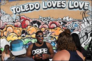 Kevin Jewell sings along to the live music during last year's Equality Toledo Loves Love Fest. The 2018 event begins Saturday at 3 p.m.