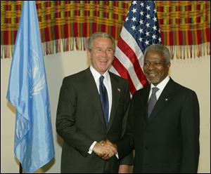 In this September, 2004 file photo United Nations Secretary General Kofi Anna, right, greets United States President George Bush, before the opening of the UN General Assembly at the United Nations, in New York.