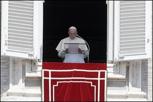 Pope Francis prays for the victims of the Kerala floods during the Angelus noon prayer in St.Peter's Square, at the Vatican. 