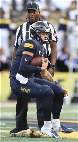 Toledo quarterback Mitchell Guadagni uns the ball against VMI during a football game on September 1 at the Glass Bowl.
